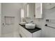 Contemporary bathroom featuring dual vessel sinks, sleek vanity, and modern fixtures at 3708 Lorraine Ln, Las Vegas, NV 89120