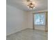 Bedroom featuring a large window, a modern chandelier, and neutral walls at 3708 Lorraine Ln, Las Vegas, NV 89120