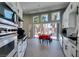 Bright kitchen with white cabinets, stainless appliances, and seamless indoor/outdoor living at 3708 Lorraine Ln, Las Vegas, NV 89120