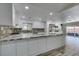 Kitchen featuring large island with stone countertop, stainless appliances, and white cabinets at 3708 Lorraine Ln, Las Vegas, NV 89120