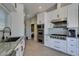 Updated kitchen with white cabinetry, stainless steel appliances and sleek countertops at 3708 Lorraine Ln, Las Vegas, NV 89120