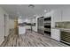 Bright kitchen with stainless steel appliances, wine cooler, and custom cabinets at 3708 Lorraine Ln, Las Vegas, NV 89120