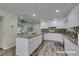 Open kitchen with large island, modern appliances, and light-filled living area at 3708 Lorraine Ln, Las Vegas, NV 89120