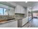 Modern kitchen with stainless steel appliances, granite countertops, and access to the patio at 3708 Lorraine Ln, Las Vegas, NV 89120