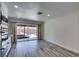Kitchen space with stainless steel appliances and sliding door access to covered patio at 3708 Lorraine Ln, Las Vegas, NV 89120