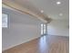 Bright living room with modern flooring, neutral walls, and sliding glass doors at 3708 Lorraine Ln, Las Vegas, NV 89120