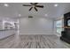 Living room showcasing plank flooring, fireplace, and open access to the kitchen at 3708 Lorraine Ln, Las Vegas, NV 89120