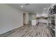 Open concept living space with kitchen access and plank flooring at 3708 Lorraine Ln, Las Vegas, NV 89120