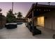 String lights illuminate this charming patio overlooking the pool, spa and palm trees at 3708 Lorraine Ln, Las Vegas, NV 89120