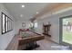 Recreation room with a pool table, and exit door to the backyard at 3708 Lorraine Ln, Las Vegas, NV 89120