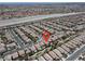 An aerial view of a two-story home in a large residential neighborhood in Las Vegas, NV, with a mountain view at 4036 W Bird Man Ln, North Las Vegas, NV 89084