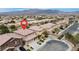 An aerial view of a two-story home highlighting a landscaped front yard and the surrounding neighborhood in Las Vegas, NV at 4036 W Bird Man Ln, North Las Vegas, NV 89084