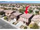 Aerial view of two-story house with tile roof and desert landscaping at 4036 W Bird Man Ln, North Las Vegas, NV 89084