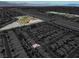 A high aerial view shows a single-Gathering home near a park in a residential neighborhood in Las Vegas, Nevada at 4036 W Bird Man Ln, North Las Vegas, NV 89084