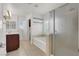 Well-appointed bathroom featuring a glass shower, soaking tub, and modern fixtures for a spa-like experience at 4036 W Bird Man Ln, North Las Vegas, NV 89084
