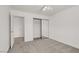 A bedroom features sliding mirror closet doors, and neutral paint at 4036 W Bird Man Ln, North Las Vegas, NV 89084
