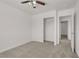 A bedroom features a ceiling fan, closet, and neutral walls at 4036 W Bird Man Ln, North Las Vegas, NV 89084