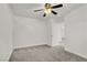 A bedroom features a ceiling fan and a connected bathroom at 4036 W Bird Man Ln, North Las Vegas, NV 89084