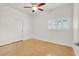 Comfortable bedroom with a ceiling fan, natural light, and closet space at 4036 W Bird Man Ln, North Las Vegas, NV 89084