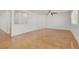Empty room featuring white walls, ceiling fan and stained concrete floors at 4036 W Bird Man Ln, North Las Vegas, NV 89084