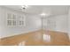 Bright living room featuring shuttered windows and concrete floors at 4036 W Bird Man Ln, North Las Vegas, NV 89084
