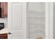 Walk-in pantry with organized shelving for optimal storage at 4036 W Bird Man Ln, North Las Vegas, NV 89084