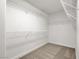 A walk-in closet features wire shelving on three sides, providing ample storage space at 4036 W Bird Man Ln, North Las Vegas, NV 89084