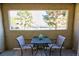 Cozy balcony with a table and chairs, offering a relaxing outdoor space at 4200 S Valley View Blvd # 1035, Las Vegas, NV 89103
