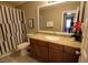Well-maintained bathroom featuring granite countertop and a shower with curtain at 4200 S Valley View Blvd # 1035, Las Vegas, NV 89103