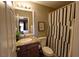 Bathroom featuring granite countertop, vanity with mirror and shower with patterned curtain at 4200 S Valley View Blvd # 1035, Las Vegas, NV 89103