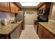 Well-equipped kitchen featuring stainless steel appliances and stone countertops at 4200 S Valley View Blvd # 1035, Las Vegas, NV 89103