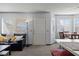 Cozy living room featuring a leather couch and natural light from the windows at 433 Mesa Blvd # 201, Mesquite, NV 89027