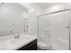 Well-lit bathroom featuring a glass door shower and modern fixtures and finishes at 4348 Bayley Skye Ave, Las Vegas, NV 89141