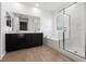 Modern bathroom featuring double sinks, a separate shower, and a luxurious soaking tub at 4348 Bayley Skye Ave, Las Vegas, NV 89141