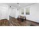 Bright dining area featuring wood-look flooring and a contemporary table set at 4348 Bayley Skye Ave, Las Vegas, NV 89141