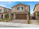 Two-story home featuring a brick-accented garage and beautifully landscaped front yard at 4348 Bayley Skye Ave, Las Vegas, NV 89141