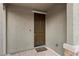 Elegant front door with a welcoming 'Welcome to our home' doormat on a brick-paved porch at 4348 Bayley Skye Ave, Las Vegas, NV 89141