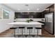 Spacious kitchen featuring barstool seating, stainless steel appliances, and plenty of room at 4348 Bayley Skye Ave, Las Vegas, NV 89141