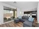 Comfortable living room featuring a sliding glass doors to the outdoor patio and kitchen access at 4348 Bayley Skye Ave, Las Vegas, NV 89141