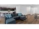 Open concept living space featuring a kitchen, living, and dining area with hardwood floors at 4348 Bayley Skye Ave, Las Vegas, NV 89141
