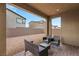 Covered patio area with outdoor furniture, perfect for relaxing and enjoying the backyard view at 4348 Bayley Skye Ave, Las Vegas, NV 89141