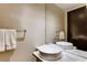 Modern bathroom featuring a vessel sink, marble countertop, and a large mirror at 4381 W Flamingo Rd # 3221, Las Vegas, NV 89103