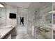 Luxurious bathroom with marble tiling, glass-enclosed shower, and modern fixtures at 4381 W Flamingo Rd # 3221, Las Vegas, NV 89103