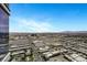 Scenic city view showcasing commercial properties and distant mountain range at 4381 W Flamingo Rd # 3221, Las Vegas, NV 89103