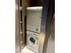 Efficient laundry room featuring stacked washer and dryer units in a cozy space at 4381 W Flamingo Rd # 3221, Las Vegas, NV 89103