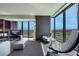Inviting living room featuring city views, modern furniture, and lots of natural light at 4381 W Flamingo Rd # 3221, Las Vegas, NV 89103