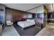 Serene bedroom with mirrored wall, luxe furnishings, and a sleek, modern design at 4381 W Flamingo Rd # 3221, Las Vegas, NV 89103