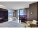Bright main bedroom with a soaking tub, city views, and a comfortable seating area at 4381 W Flamingo Rd # 3221, Las Vegas, NV 89103