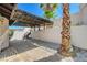 Cozy backyard featuring pavers, a shaded pergola, and low-maintenance landscaping at 439 Columbia Ct, Boulder City, NV 89005