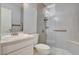 Bathroom featuring white vanity, toilet and tiled shower at 439 Columbia Ct, Boulder City, NV 89005